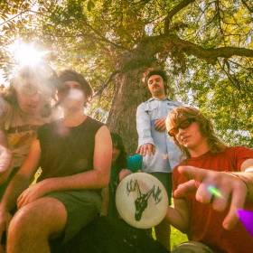 Photo of Llano bandmembers outdoors