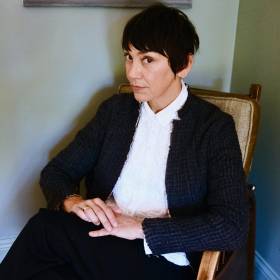 Picture of Inara George sitting in chair