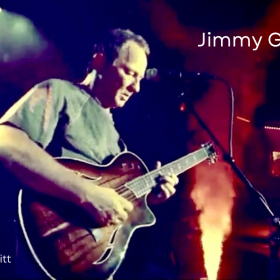 photo of Jimmy George playing guitar
