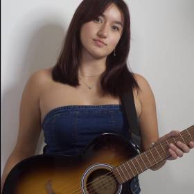 Emma Grace with guitar