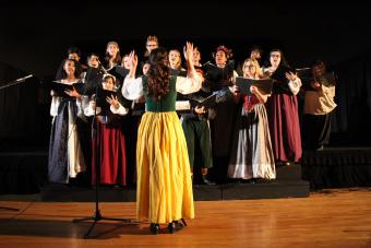 Choir members at Madrigal Dinner singing