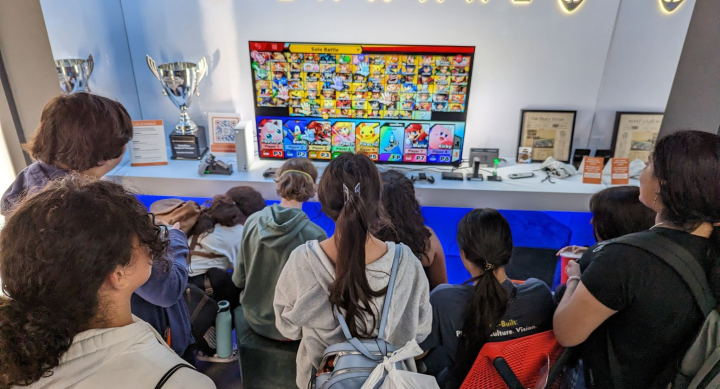 Students playing on the console in the Alienware Longhorn Esports Lounge