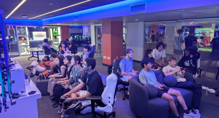 Students playing in the Arena Console Area during UT Freshman Orientation 